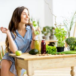 Canva-Woman-with-green-healthy-food-at-home-256x256